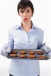 Woman Holding Burnt Cookies