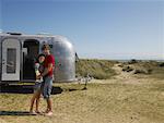 Portrait of Couple in Front of Camper