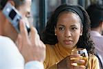 Woman Looking at Man Talk on Cellular Phone