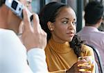 Woman Looking Away while Man Talks on Cellular Phone