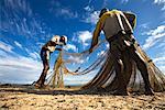 Fishermen Pulling in Nets on Beach, Antongil Bay, Maroantsetra, Madagascar