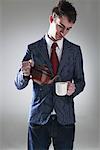 Young Man Pouring Cup of Tea