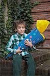 Portrait of Boy Holding Gift