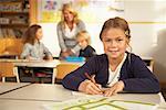 Portrait of Girl Sitting at Desk in Classroom