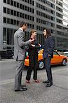 Business People Standing on Sidewalk