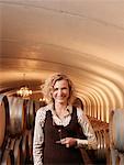 Woman Standing in Wine Cellar