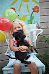 Girl at Birthday Party with Dog