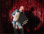 Man Playing Accordion on Stage