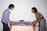 Man and Woman Playing Table Soccer
