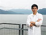 Portrait of Man Standing on Deck by Ocean