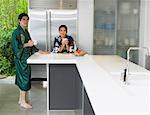 Couple Drinking Coffee in Kitchen