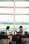 Couple Toasting in Airport, Vancouver, British Columbia, Canada