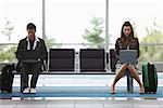 Man and Woman in Airport Waiting Area