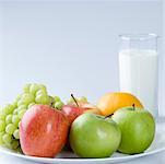 Glass of milk with fruits