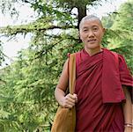 Close-up of a mid adult man smiling, McLeod Ganj, Dharmakot, Dharamshala, Himachal Pradesh, India