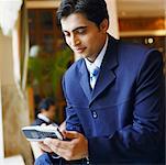 Close-up of a businessman using a mobile phone