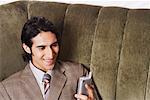 Close-up of a businessman holding a mobile phone