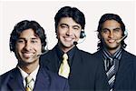 Portrait of three male customer service representatives smiling