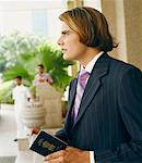 Close-up of a businessman holding a passport