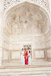 Portrait of three young women standing in a mausoleum, Taj Mahal, Agra, Uttar Pradesh, India
