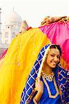 Portrait of a young woman with a camel, Taj Mahal, Agra, Uttar Pradesh, India