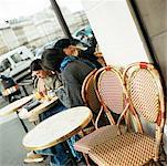 Teenagers sitting at cafe terrace