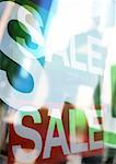 Word sale on shop windows, composite, close-up