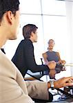 Business people sitting at table, blurred