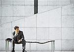 Businessman sitting on bench