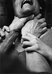 Hands strangling woman, close-up, b&w