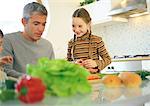 Father and daughter in kitchen