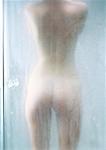 Woman in shower, rear view.