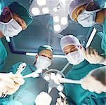 Surgical team preparing to operate, low angle view