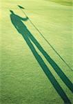 Schatten der Golfspieler mit Golfflagge
