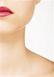 Woman´s lower face, neck and bare upper chest - SuperStock