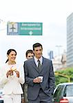 Group of business associates walking with coffees