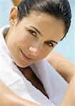 Woman with towel around neck smiling