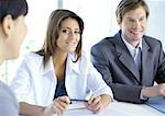 Business meeting, woman smiling at camera