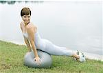 Woman exercising with pilates ball