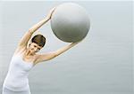 Woman working out with fitness ball