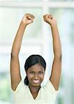 Teen girl with arms up