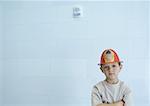 Boy wearing fireman's hat