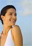 Woman smiling, sky in background, portrait