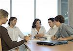 Business associates talking in conference room