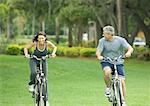 Mature couple riding bikes