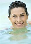 Woman in water, smiling, close-up