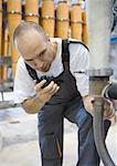 Factory worker using walkie talkie