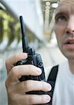 Factory worker using walkie talkie