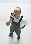 Factory worker using walkie talkie