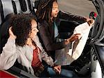 Couple Looking at Map in Car